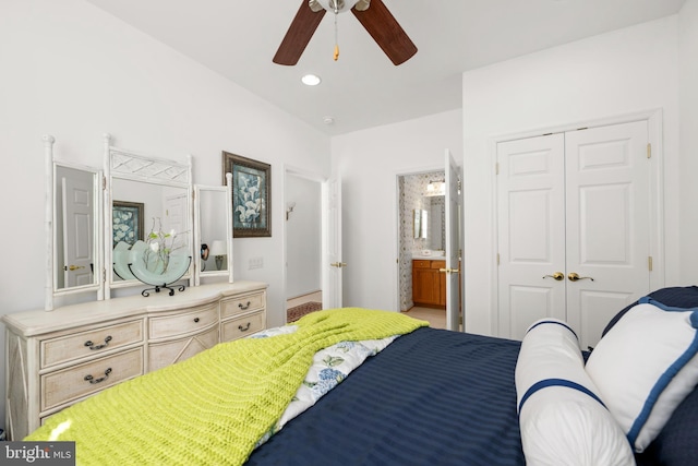 bedroom with ensuite bath, ceiling fan, and a closet