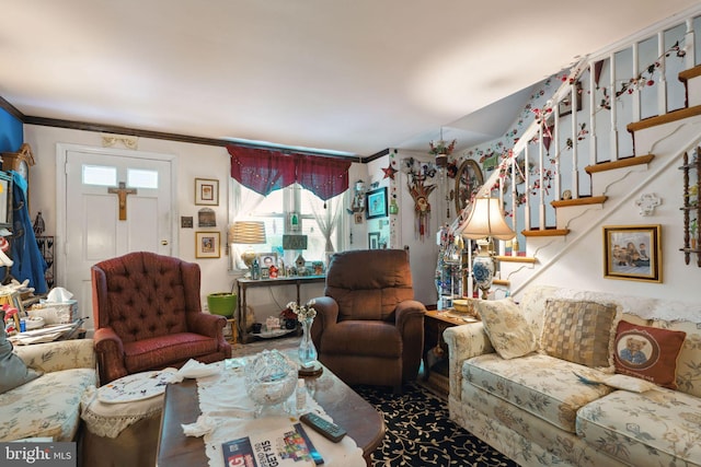 living room with crown molding and a healthy amount of sunlight