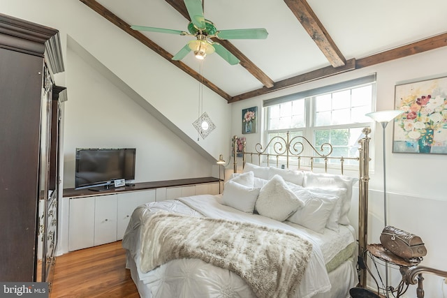 bedroom with dark hardwood / wood-style flooring, lofted ceiling with beams, and ceiling fan