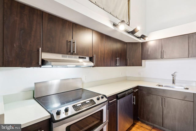 kitchen featuring dark brown cabinets, appliances with stainless steel finishes, and sink