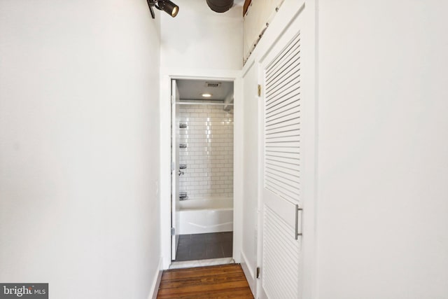 corridor with dark wood-type flooring