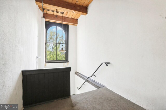 stairs with wood ceiling and beam ceiling