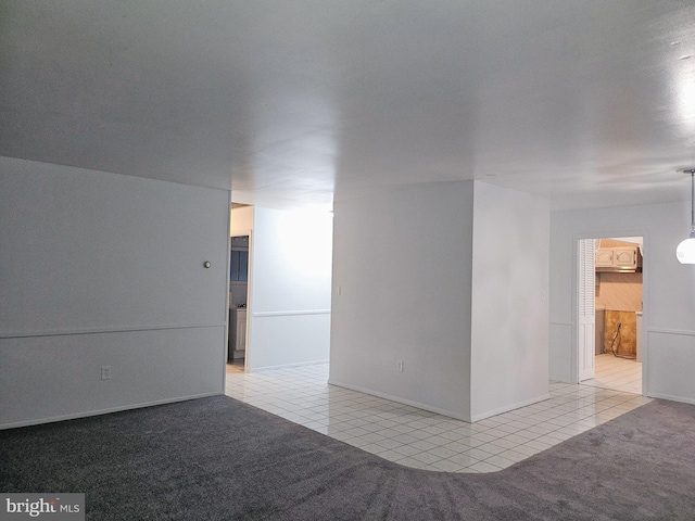 unfurnished room featuring light tile patterned floors