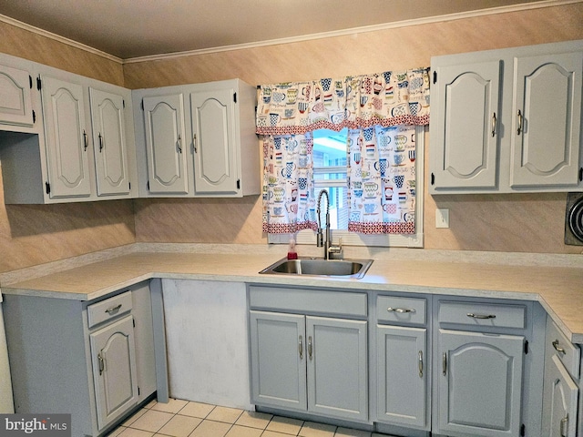 kitchen featuring light tile patterned flooring, sink, and gray cabinetry