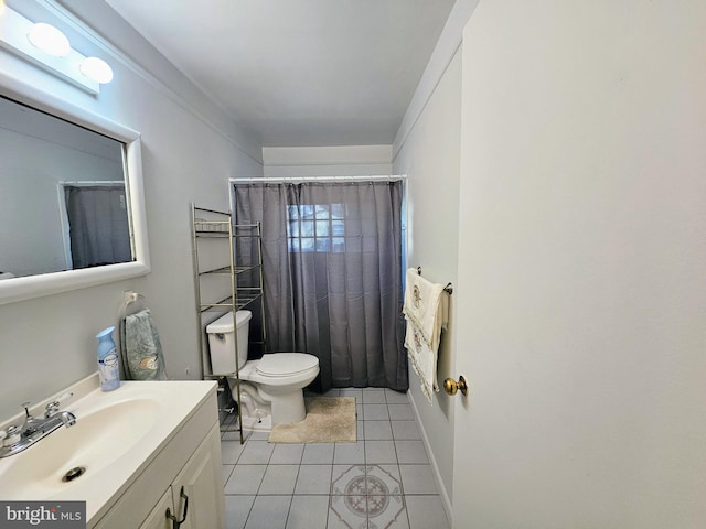 bathroom with vanity, tile patterned flooring, and toilet