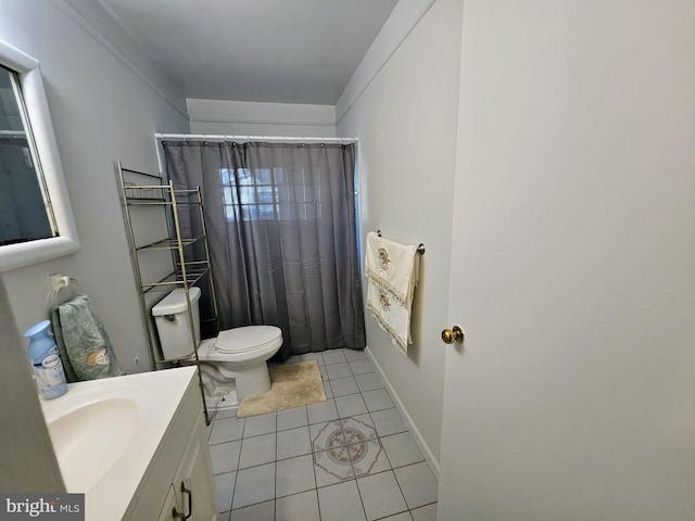 bathroom with vanity, tile patterned flooring, toilet, and curtained shower