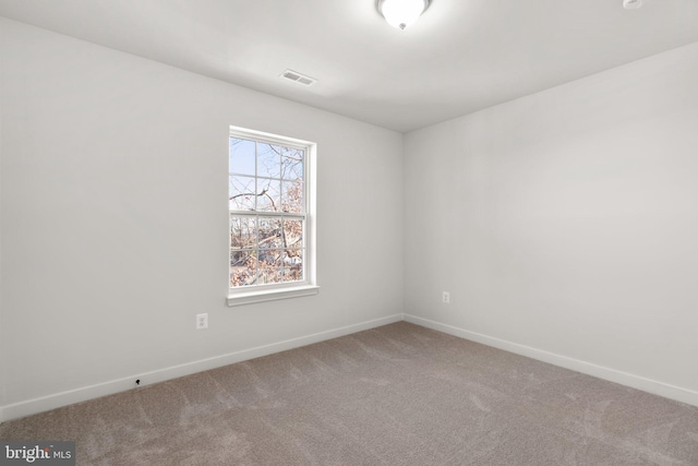 empty room featuring carpet floors