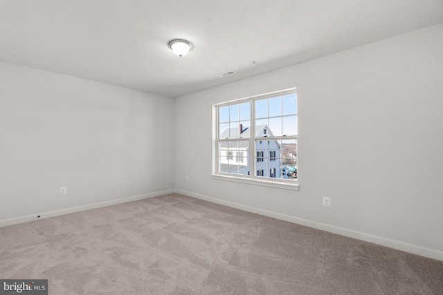 unfurnished room with light carpet