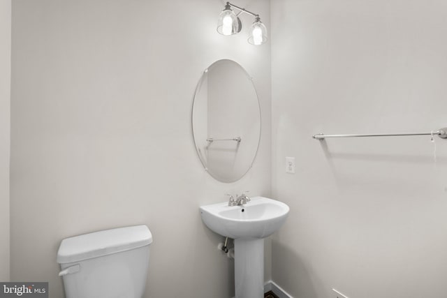 bathroom with toilet and sink