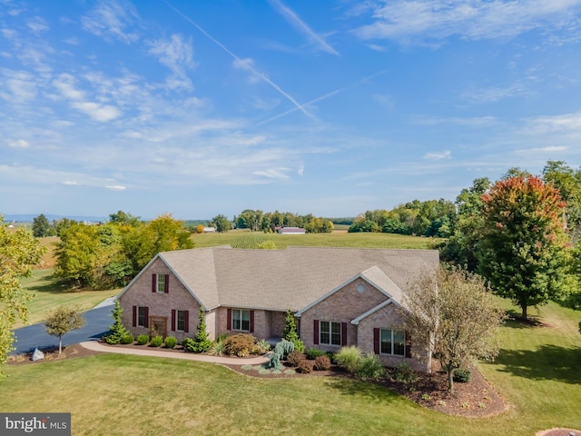 single story home featuring a front yard