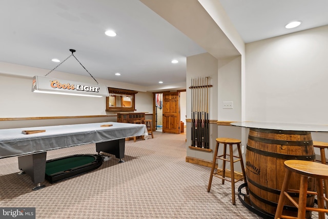 playroom with billiards, light carpet, and indoor bar