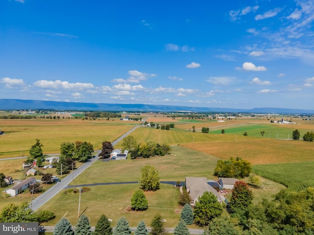 drone / aerial view with a mountain view and a rural view