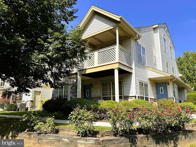 view of front of home with a balcony