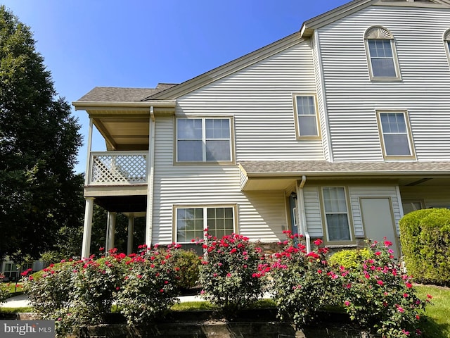 view of front of property with a balcony