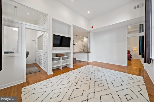 bedroom with hardwood / wood-style flooring