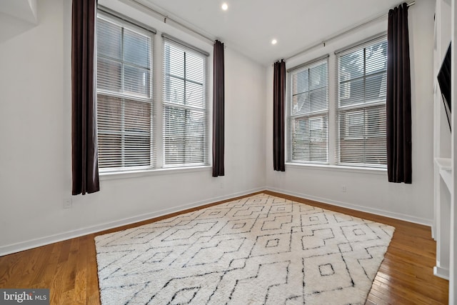 unfurnished room with light hardwood / wood-style flooring