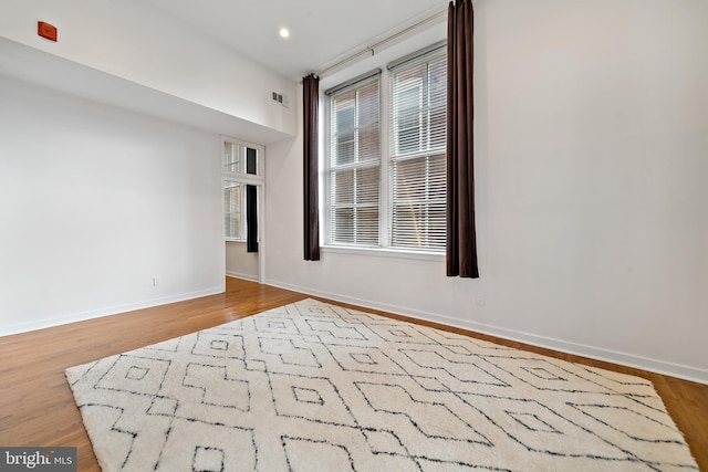 empty room with light hardwood / wood-style floors