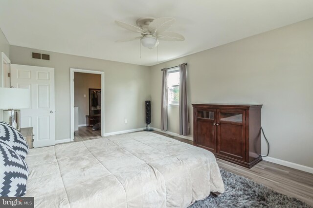 bedroom featuring light hardwood / wood-style flooring and ceiling fan