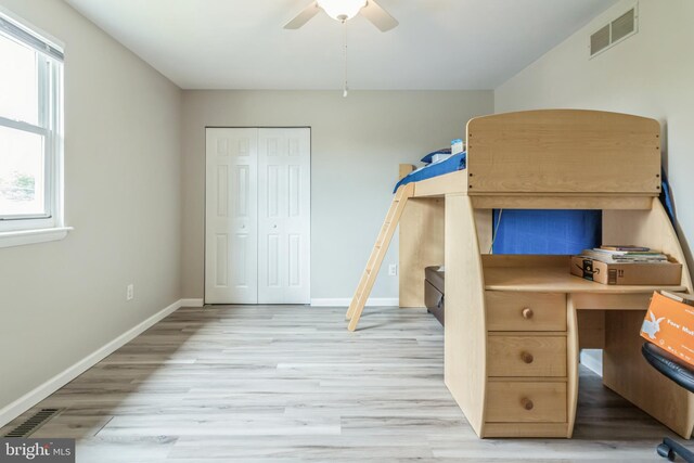 bathroom with vanity, toilet, and hardwood / wood-style flooring