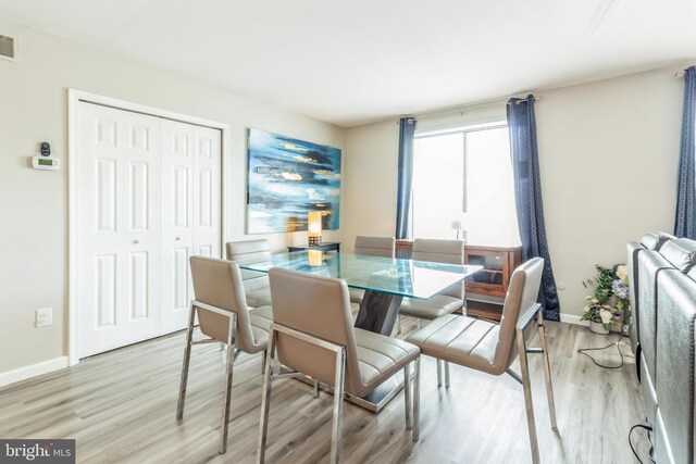 dining room featuring light wood-type flooring