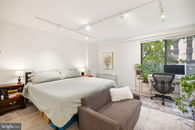 bedroom with light hardwood / wood-style flooring