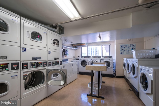 laundry room with stacked washer and clothes dryer and washing machine and clothes dryer