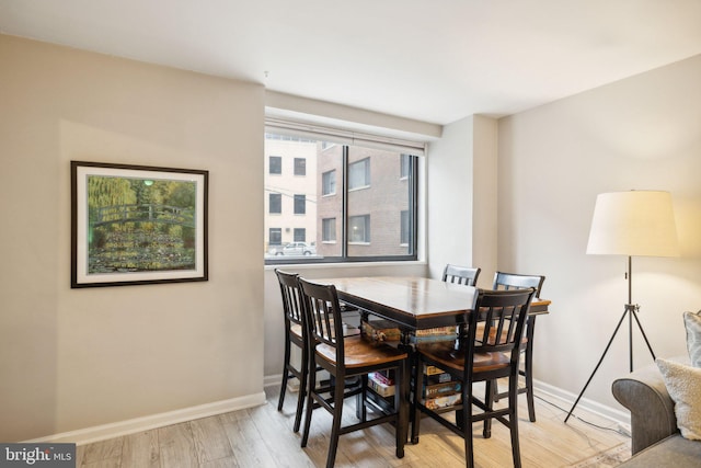 dining room with light hardwood / wood-style flooring