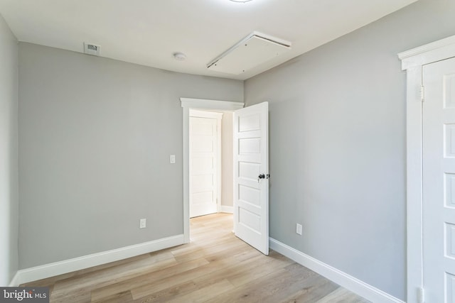 spare room with light wood-type flooring