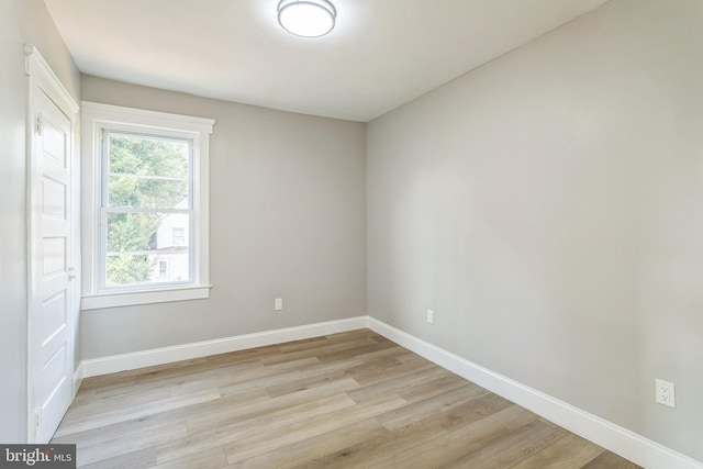 spare room with light hardwood / wood-style floors