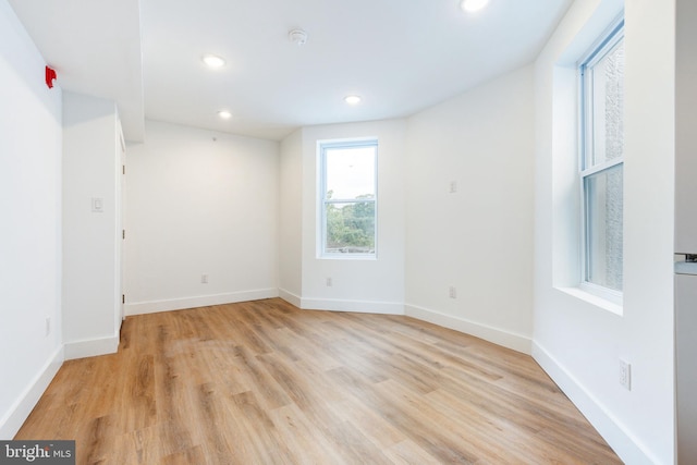 unfurnished room with light hardwood / wood-style floors