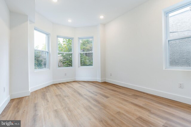 spare room featuring light hardwood / wood-style floors