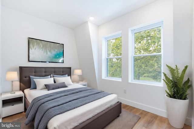 bedroom with light hardwood / wood-style floors