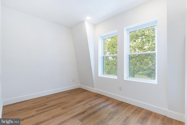 spare room with light wood-type flooring