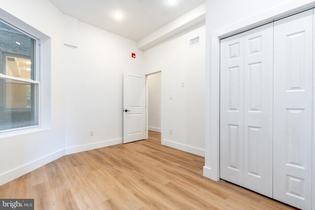 interior space featuring light hardwood / wood-style floors and a closet