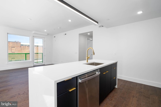 kitchen with an island with sink, stainless steel dishwasher, sink, and dark hardwood / wood-style flooring