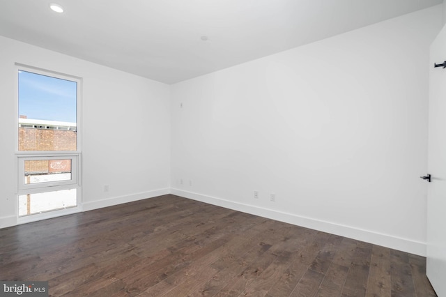 empty room featuring dark hardwood / wood-style floors