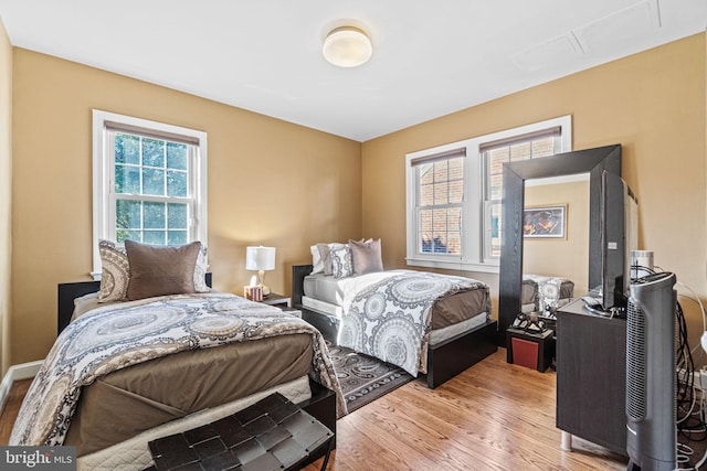 bedroom with light wood-type flooring