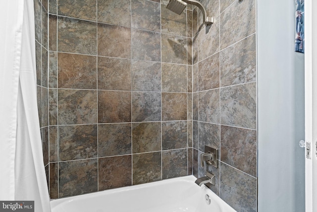 bathroom featuring shower / bathtub combination with curtain