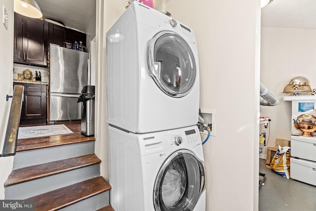 washroom featuring stacked washer / dryer