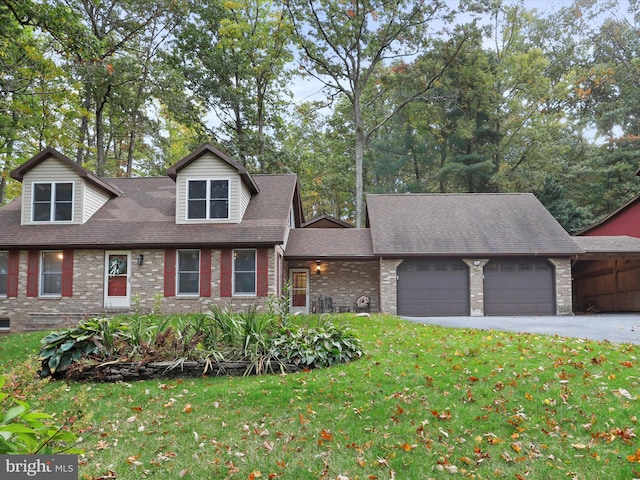 cape cod-style house with a front lawn and a garage