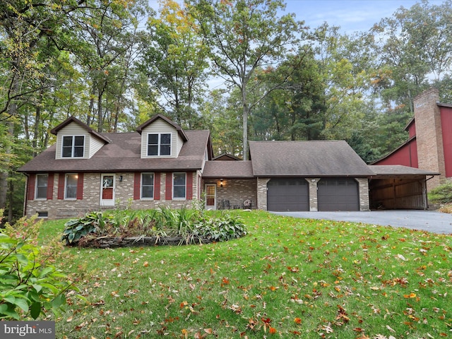 view of front of home with a garage and a front yard