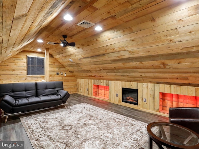 living room with wooden walls, wood ceiling, vaulted ceiling, and dark hardwood / wood-style floors