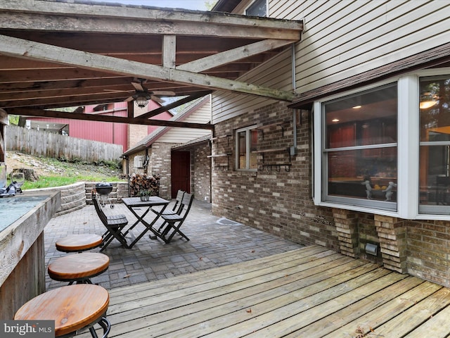 deck with ceiling fan and a patio