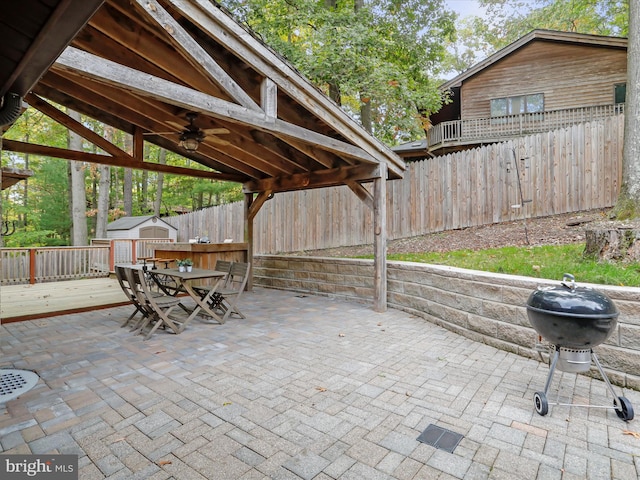 view of patio with a gazebo, grilling area, and ceiling fan