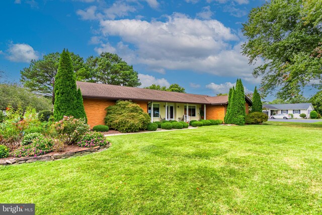 ranch-style home with a front yard