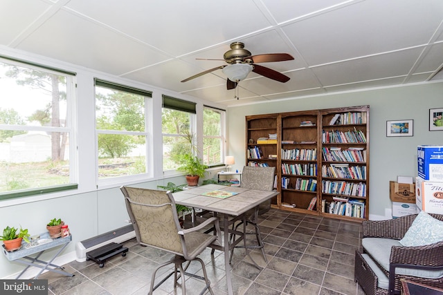 sunroom with ceiling fan and a healthy amount of sunlight