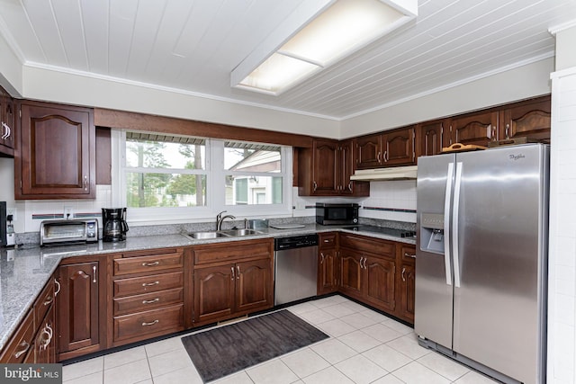 kitchen with light stone counters, sink, appliances with stainless steel finishes, light tile patterned floors, and ornamental molding