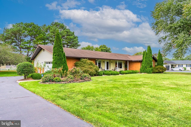 ranch-style home with a front lawn