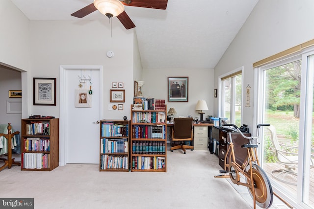 office space with ceiling fan, carpet flooring, a textured ceiling, and vaulted ceiling