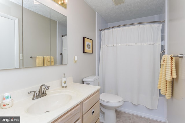 full bathroom featuring shower / bathtub combination with curtain, vanity, a textured ceiling, toilet, and tile patterned floors